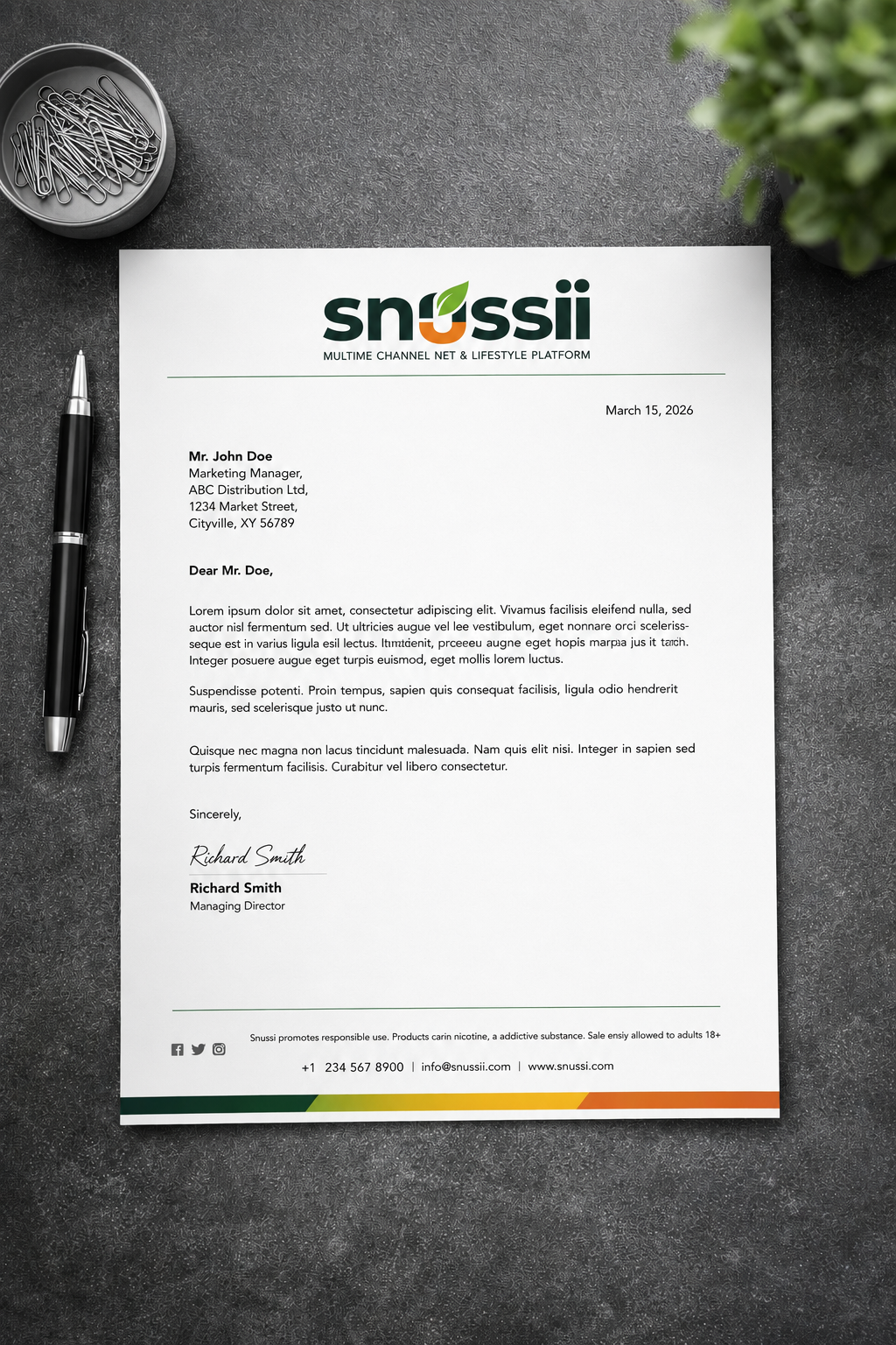 SNUSSI official letterhead with logo, correspondence layout, compliance disclaimer, and green-orange footer bar